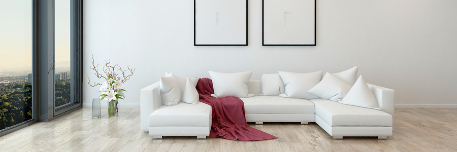 minimally decorated condo interior with white couch