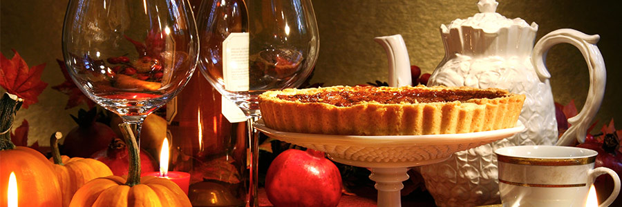 a dinner table set with thanksgiving feast