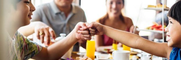 family-having-breakfast-at-boutique-hotel family having breakfast in hotel